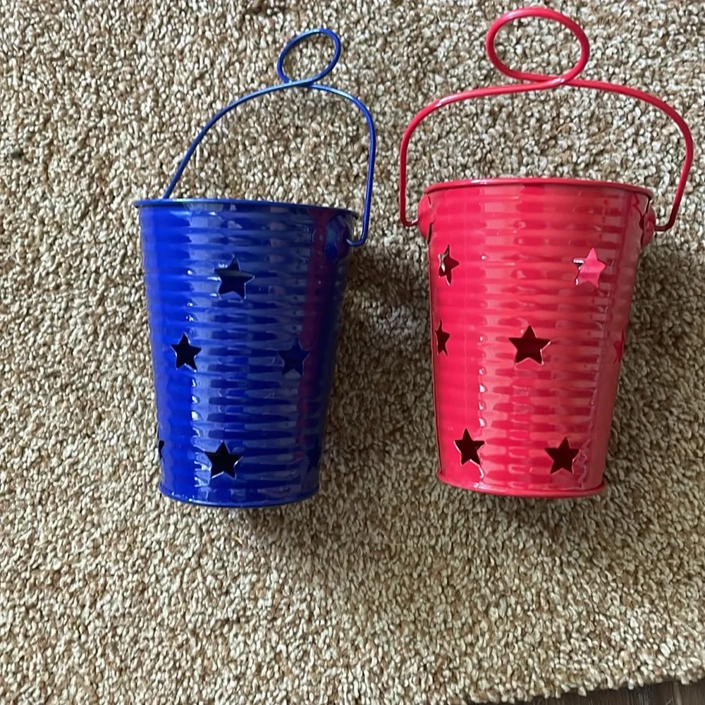 Red and Blue metal candle holders with star cut outs